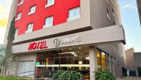 a red building with a hotelymvs sign on it at Dunamys Hotel Londrina in Londrina