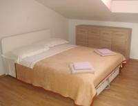 Postel nebo postele na pokoji v ubytování Apartments Jelicic
