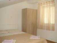 Postel nebo postele na pokoji v ubytování Apartments Jelicic