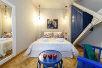 Postel nebo postele na pokoji v ubytování Candia Suites & Rooms