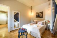 Postel nebo postele na pokoji v ubytování Candia Suites & Rooms