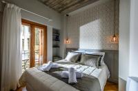 Postel nebo postele na pokoji v ubytování Candia Suites & Rooms