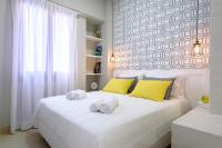 Postel nebo postele na pokoji v ubytování Candia Suites & Rooms