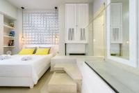 Postel nebo postele na pokoji v ubytování Candia Suites & Rooms