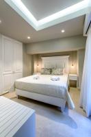 Postel nebo postele na pokoji v ubytování Candia Suites & Rooms