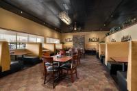 a dining room with tables and chairs in a restaurant at The Kendrick Hotel, an Ascend Collection Hotel in Flagstaff