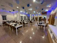 a restaurant with tables and chairs and blue balloons on the ceiling at Hotel Estrela Da Idanha in Idanha-a-Nova