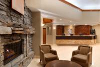 a lobby with a stone fireplace and a waiting room at Harrah's Lake Tahoe Hotel & Casino in Stateline