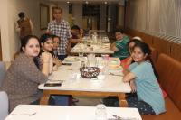 a group of people sitting at tables in a restaurant at Soil to Soul Trinity Hotel - A Boutique Stay in Somnath