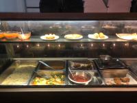 een keuken met veel schalen en borden vol eten bij e34 Café, Restaurant & Hotel Koslanda Hideaway with a Private Natural Pool in Koslanda