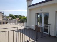 A balcony or terrace at Panorama Sunshine Apartman