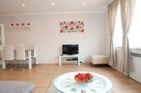 Televízia a/alebo spoločenská miestnosť v ubytovaní Aurora Apartment Danube View