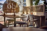 a group of tables and chairs in a restaurant at DoubleTree by Hilton Rotterdam Centre in Rotterdam