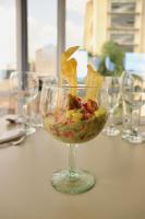 a glass bowl with food in it on a table at Giluxe Hotel in Pereira