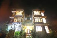 a tall building with lit windows at night at My Sweetie B&amp;B in Dongshan