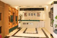 a lobby with a reception desk in a building at Humble Citadel Hotel in Lagos