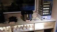 a counter top with a coffee maker and a coffee pot at Gu-Ting-Ben B&amp;B in Minxiong
