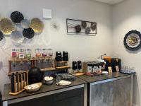 a room with a counter with many items on it at Schröders Gästehaus in Langstedt