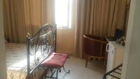 Postel nebo postele na pokoji v ubytování Ariha Hotel