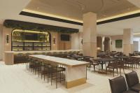 サンディエゴにあるCourtyard by Marriott San Diego Downtown Little Italyのテーブルと椅子とバーのあるレストラン