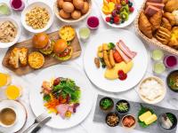 a table filled with plates of food and appetizers at Hotel Nikko Himeji in Himeji
