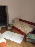 A bed or beds in a room at Hotel Bilyana