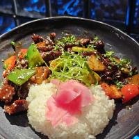 a plate of food with rice and meat and vegetables at Onora Hotel in Ulaanbaatar