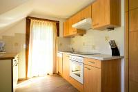 Kuchyň nebo kuchyňský kout v ubytování Apart of me Ferienhaus Faaker See