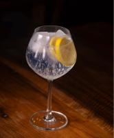 a glass of water with a lemon in it at Hotel El Candil Tilcara in Tilcara