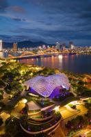 a view of a city at night with a building at ORANGE Hotel &amp; Suites - Danang City CENTER, near Dragon Bridge in Da Nang