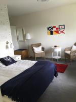 Postel nebo postele na pokoji v ubytování Nynäsgården Hotell & Konferens