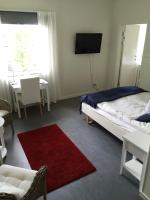 Postel nebo postele na pokoji v ubytování Nynäsgården Hotell & Konferens