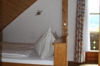 A bed or beds in a room at Biohof Sauschneider