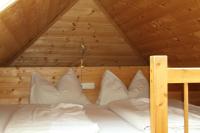 A bed or beds in a room at Biohof Sauschneider