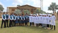 a group of people in white uniforms posing for a picture at Hôtel & Restaurant d'application Don Bosco in Tuléar