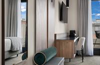 Ένα ή περισσότερα κρεβάτια σε δωμάτιο στο Leonardo Hotel Vienna City West