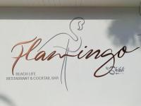 une enseigne de magasin avec une femme en robe dans l'établissement Ghibli Hotel, à Civitanova Marche