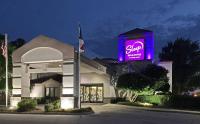 una señal de stop en la parte delantera de un edificio en Sleep Inn &amp; Suites Spring Lake - Fayetteville near Fort Bragg, en Spring Lake