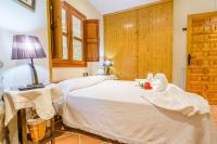 Postel nebo postele na pokoji v ubytování La Casita con piscina privada de tres dormitorios