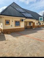 a building with solar panels on top of it at Ohio city hotel in Owerri