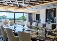 a conference room with a long table and white chairs at Four Seasons Hotel in Limassol