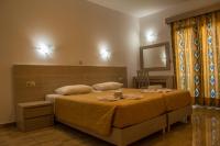 Postel nebo postele na pokoji v ubytování Zeus Hotel