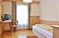 Posteľ alebo postele v izbe v ubytovaní Hotel Garnì al Plan