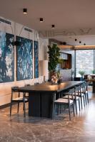 een keuken met een grote eettafel en stoelen bij Mavilu Luxury Hotel in Bodrum City