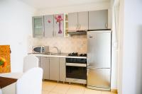 Kuchyň nebo kuchyňský kout v ubytování Floral Apartment