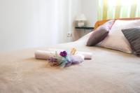 Postel nebo postele na pokoji v ubytování Floral Apartment