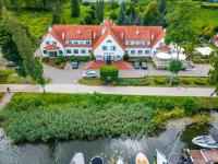 an aerial view of a large house with a marina at Amax Boutique Hotel in Mikołajki
