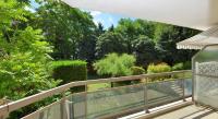 a balcony with a view of a garden at Appart&#39; Rachais in Lyon