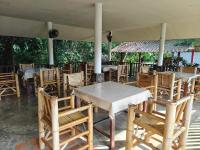 a group of tables and chairs under a tent at TheOrientalVillage in Ban Pao Sam Kha
