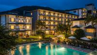 an image of a hotel with a swimming pool at night at Hotel Barahi Pokhara in Pokhara